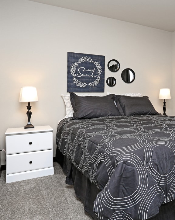 a bedroom with a bed and two night stands