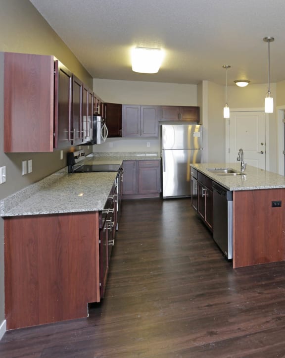 an open floor plan with a kitchen and living room