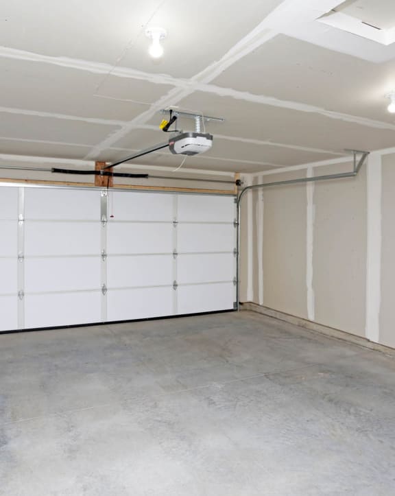 a white garage with a white door and white walls