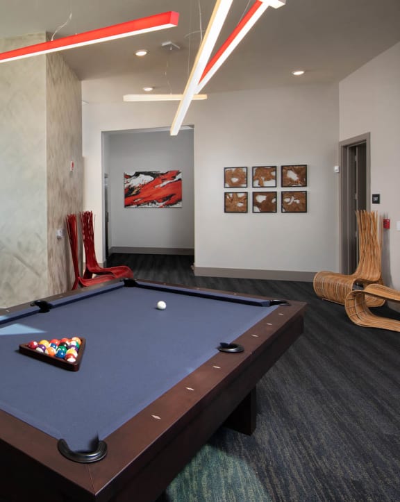 a room with a pool table in it at Luxor Club, Jacksonville, FL