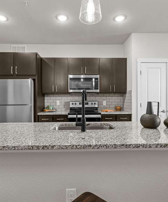 Discovery at The Realm Apartments in Lewisville, TX Model Kitchen with Island