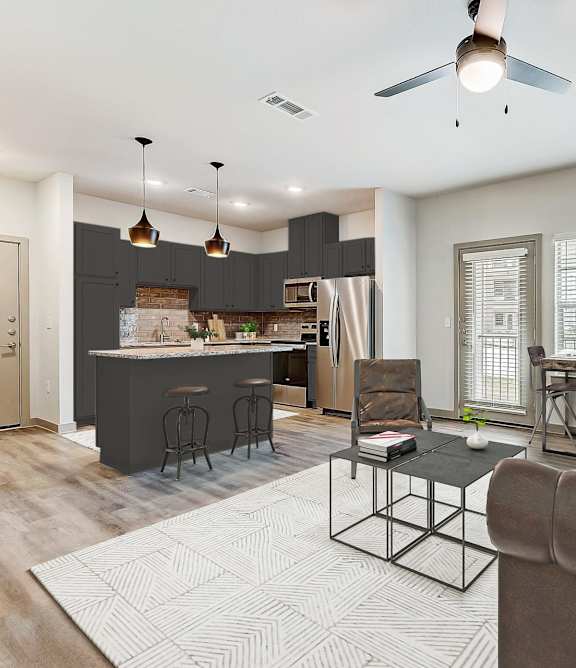 a living room and kitchen with a couch and a table