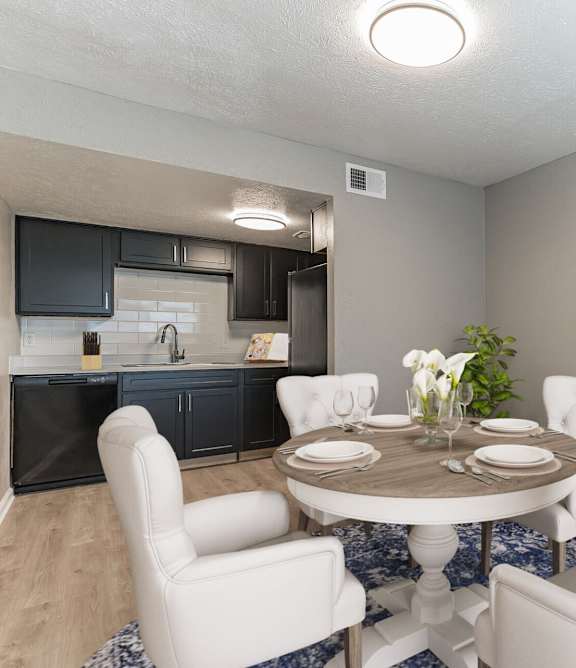 a living room with a couch and a chair and a rug at 46Eleven Apartments, Dallas, TX, 75228