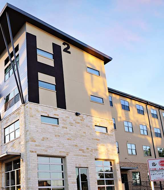 Modern building with apartment balcony at H Squared Apartments, Texas, 76201