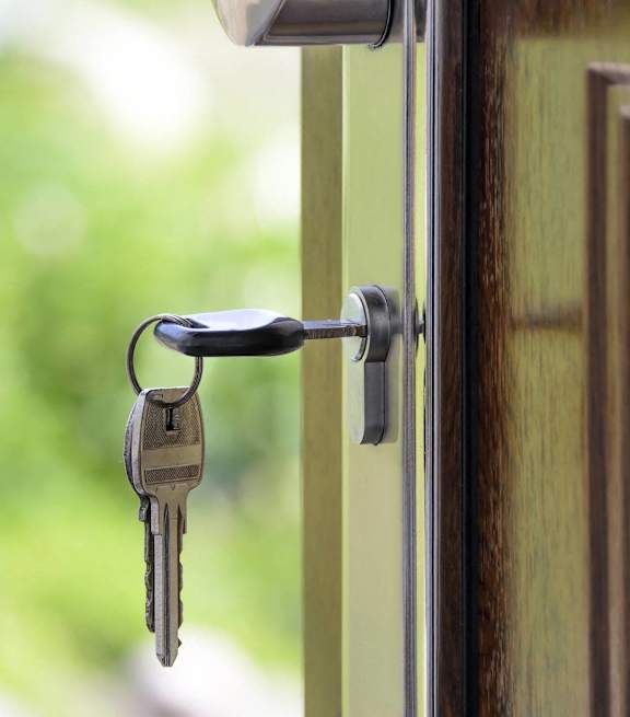 a door handle with keys hanging out of it