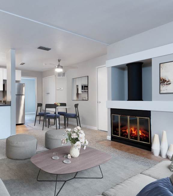 A modern living room with a fireplace and a grey sofa.