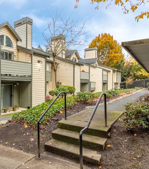 Apartment building with a red line on the sidewalk.