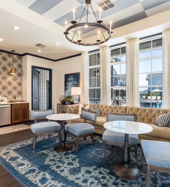 a living room with blue couches and a glass coffee table at Overland Park, Pickerington, OH