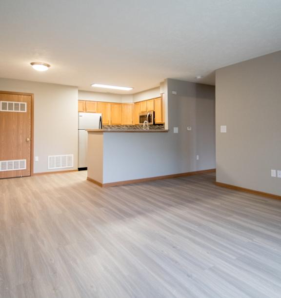 A kitchen with wooden cabinets and stainless steel appliances.
