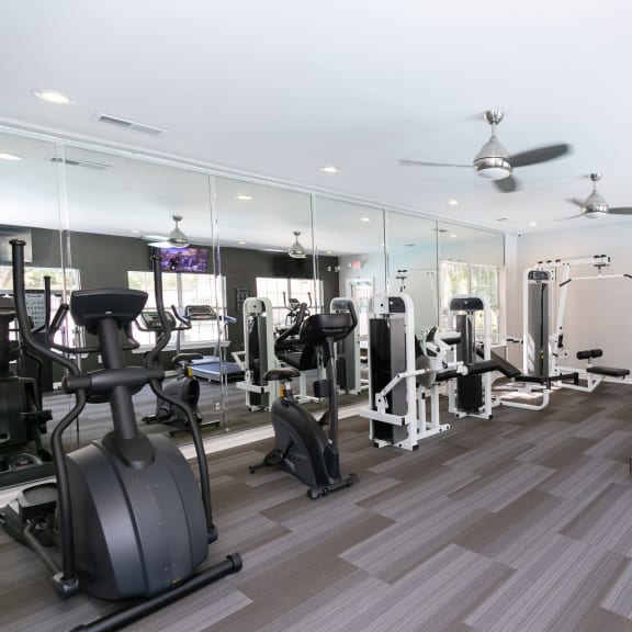 the gym is equipped with cardio machines and other fitness equipment at Gwinnett Pointe in Norcross, GA