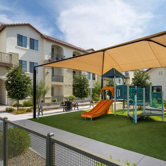 A pool area with chairs and a fountain at Cohea Archibalds.