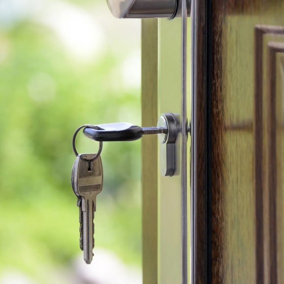a door handle with keys hanging out of it