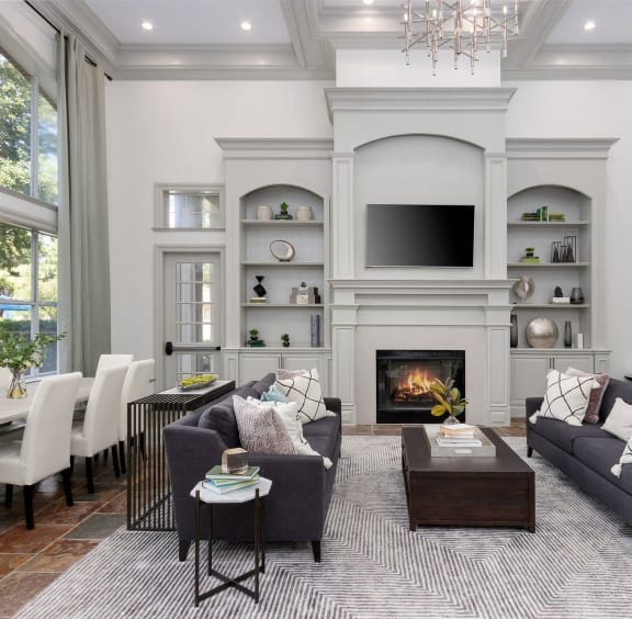 the living room has a fireplace and a large window