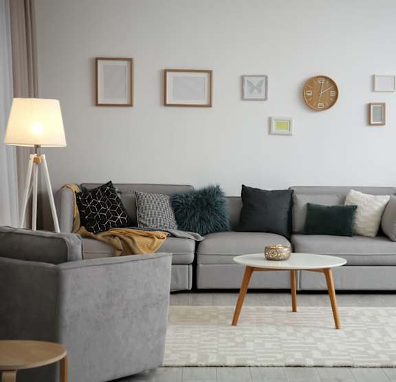 a bedroom with a bed and bookshelves     and a chair