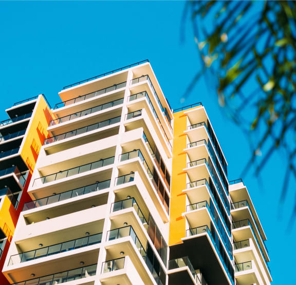 a tall building with a blue sky in the background