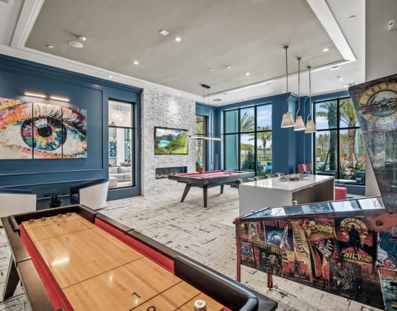 a game room with a pool table and a painting on the wall at Altis Twin Lakes Apartments, Kissimmee, FL 34744