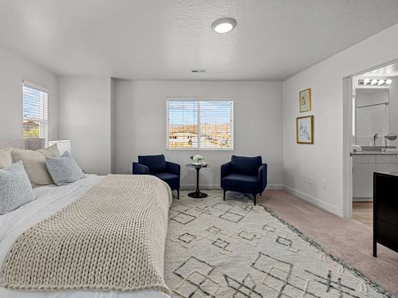 Desert Village Townhomes in Santa Clara, Utah Model Bedroom with Attached Bathroom