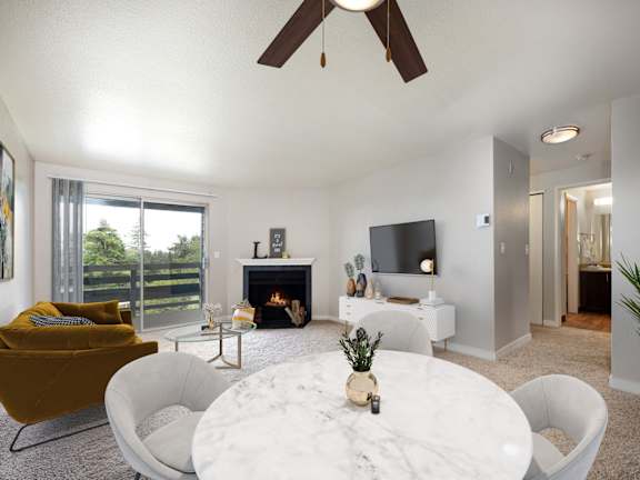 A modern living room with a fireplace and a flat screen TV.