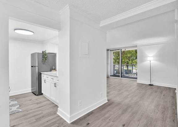 a kitchen with white cabinets and a granite counter top
