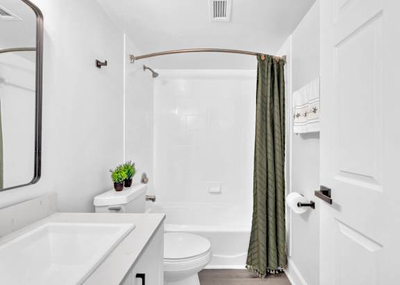 a bathroom with a toilet sink and bathtub