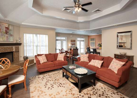 A living room with a fireplace and a couch.