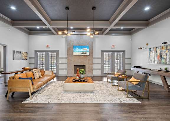 an empty living room with hardwood floors and white walls