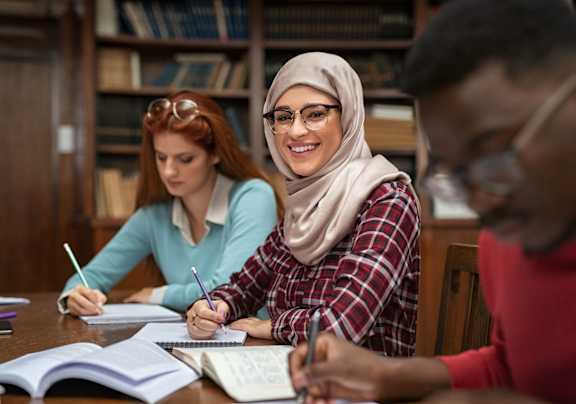 a group of students studying in a library