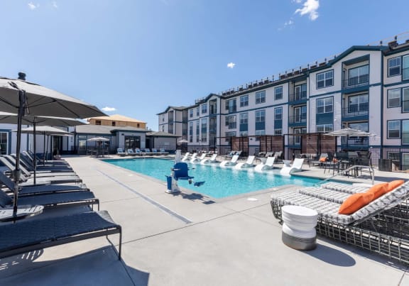 our apartments have a large pool with lounge chairs and umbrellas