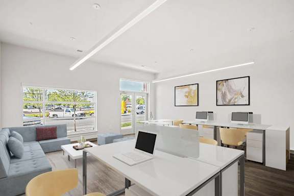 A modern office space with a view of the parking lot outside.