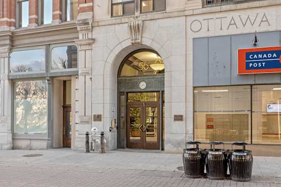 The front of a building with a sign that says Canada Post.