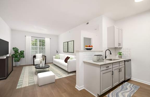 A modern kitchen with a white couch and a wooden floor. at Prescott Place, Ohio