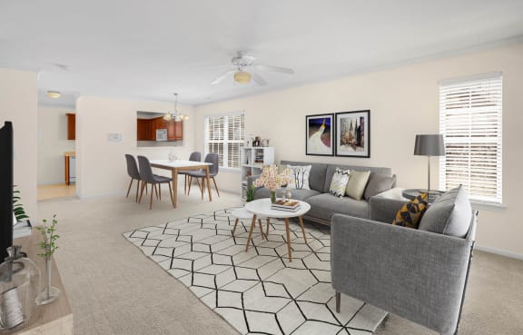 a living room with a couch and a table at Mainstreet Village, Michigan