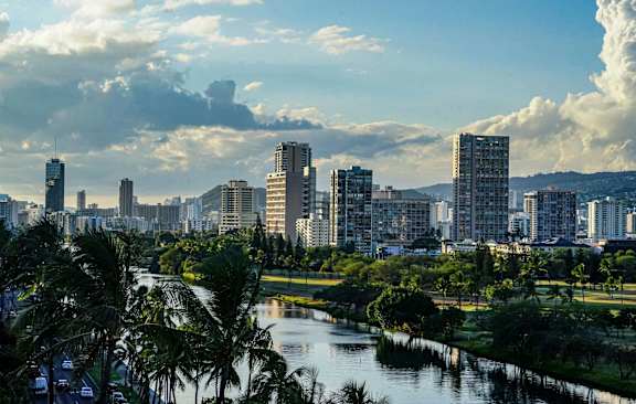 A cityscape with a river running through it.