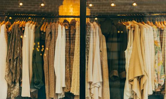 a rack of clothes in a clothing store