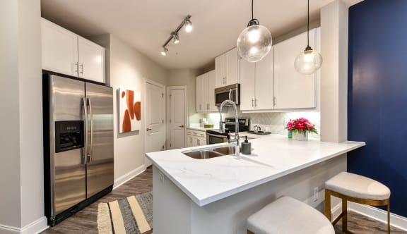 kitchen in a bedroom plus den unit.