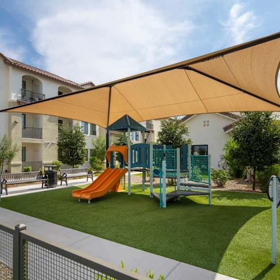 A pool area with chairs and a fountain at Cohea Archibalds.