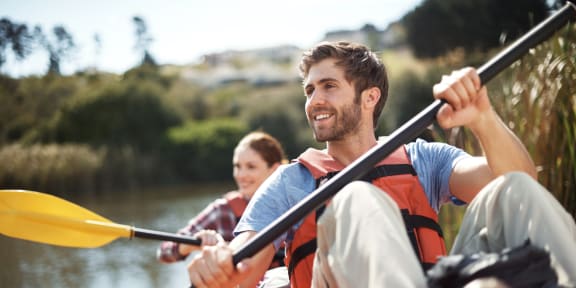 Two Kayakers on a River