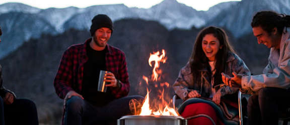 Friends Sitting Outside Around Fire Pit