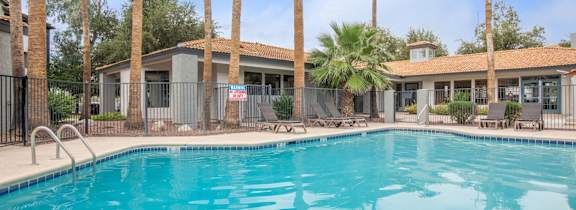 Mission Tierra Apartments in Tucson, Arizona Pool with Lounge Chairs