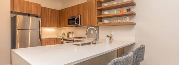 The Benedictine Apartments in Tucson, Arizona Model Kitchen with Built-In Shelving