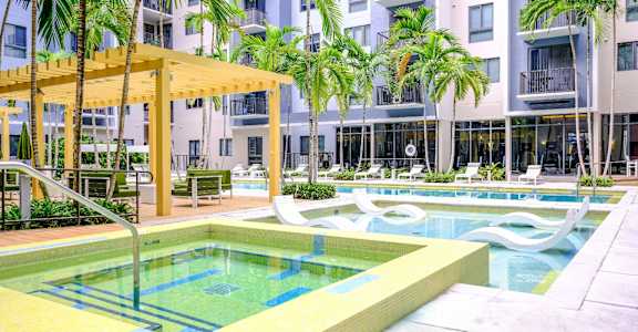 Swimming Pool with Lounge Seating at Berkshire Coral Gables, Miami, FL