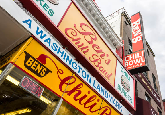a row of neon signs on the side of a building at The Shay, Washington, 20001