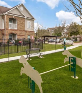 a dog park in front of a house