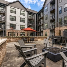 the reserve at bucklin hill patio with firepit and chairs  at Meeder Flats Apartment Homes, Cranberry Township, PA