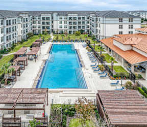 Couple Enjoying Nearby Lake at Reveal at Bayside in Rowlett Texas