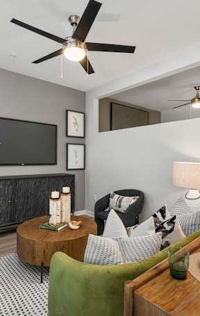 a living room and dining room with a couch and a table