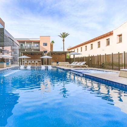 The Benedictine Apartments in Tucson, Arizona Pool with Lounge Chairs