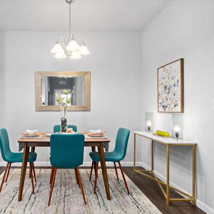 Bright dining room with wooden table and chairs at Highview Pointe, Louisville