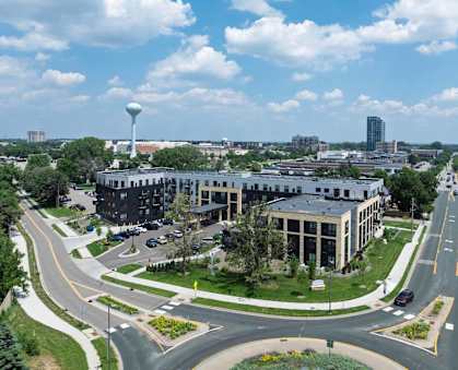 A roundabout with a building in the background.