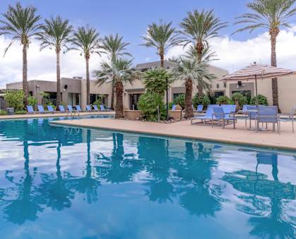 Riverwalk Luxury Apartments in Tucson, Arizona Pool with Lounge Chairs